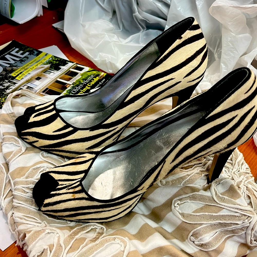 Guess high heel.  Zebra skin slight stain.